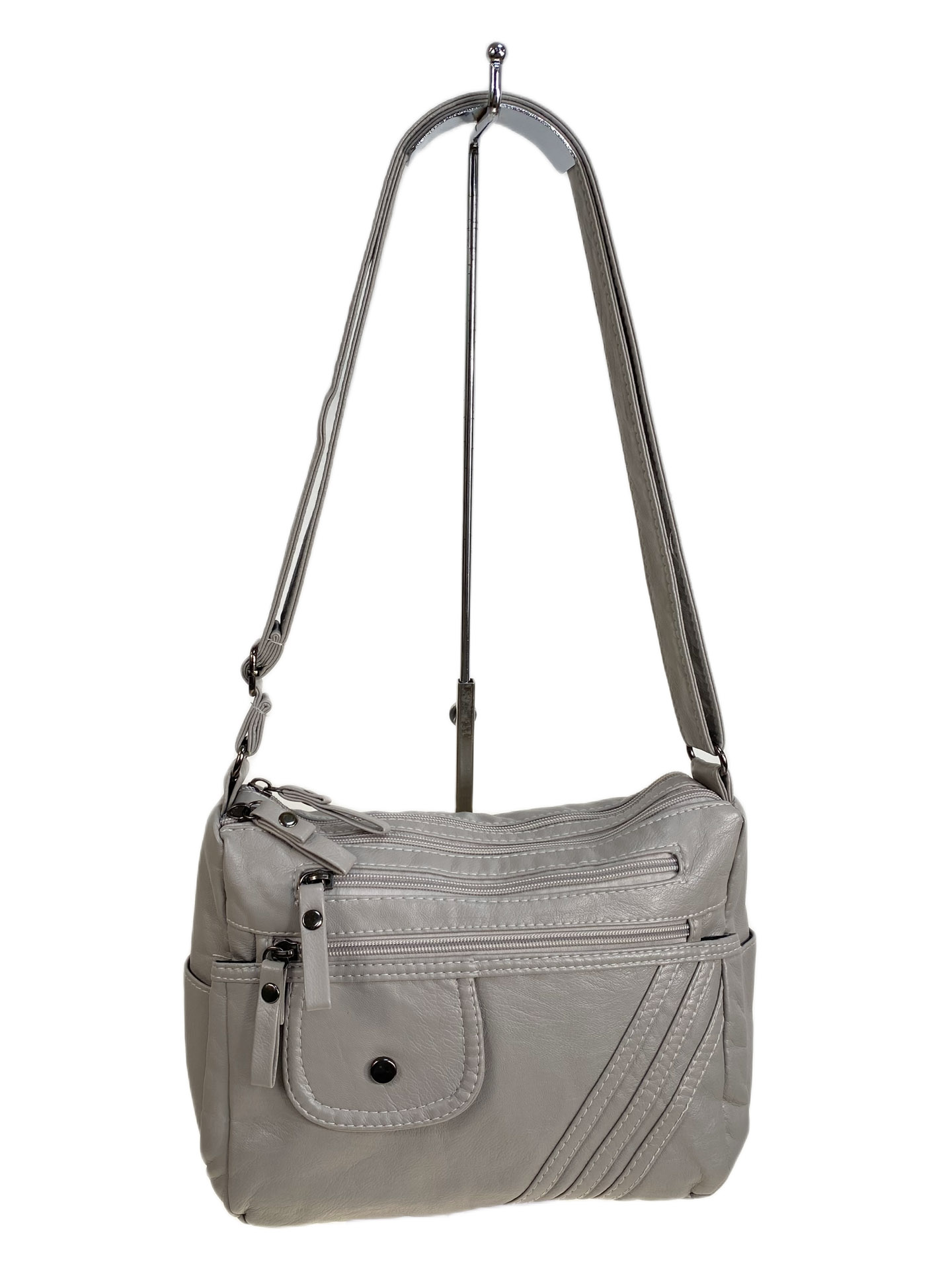 На фото 1 - Женская сумка из искусственной кожи, цвет светло серый