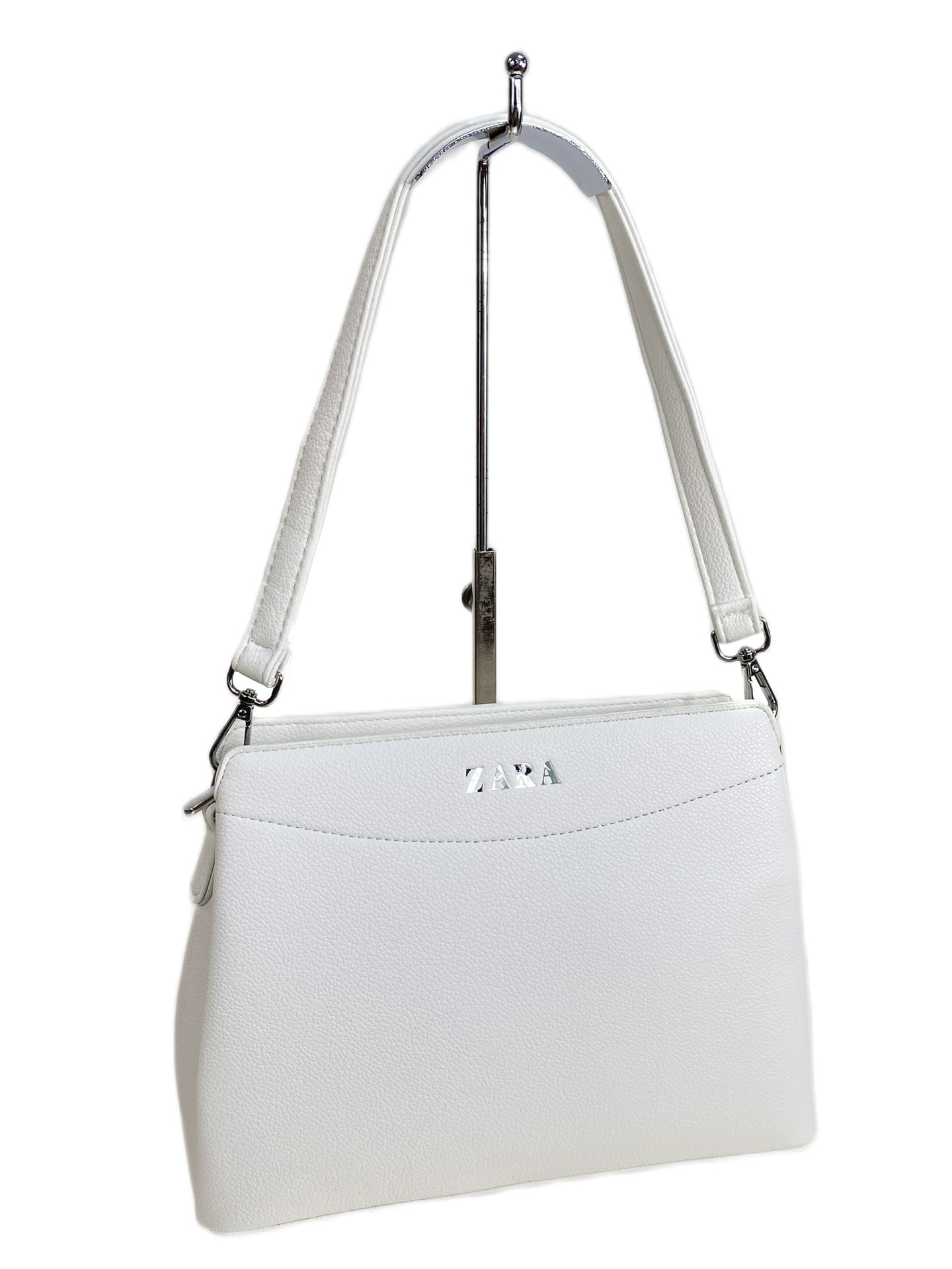 На фото 1 - Женская сумка из искусственной кожи, цвет белый