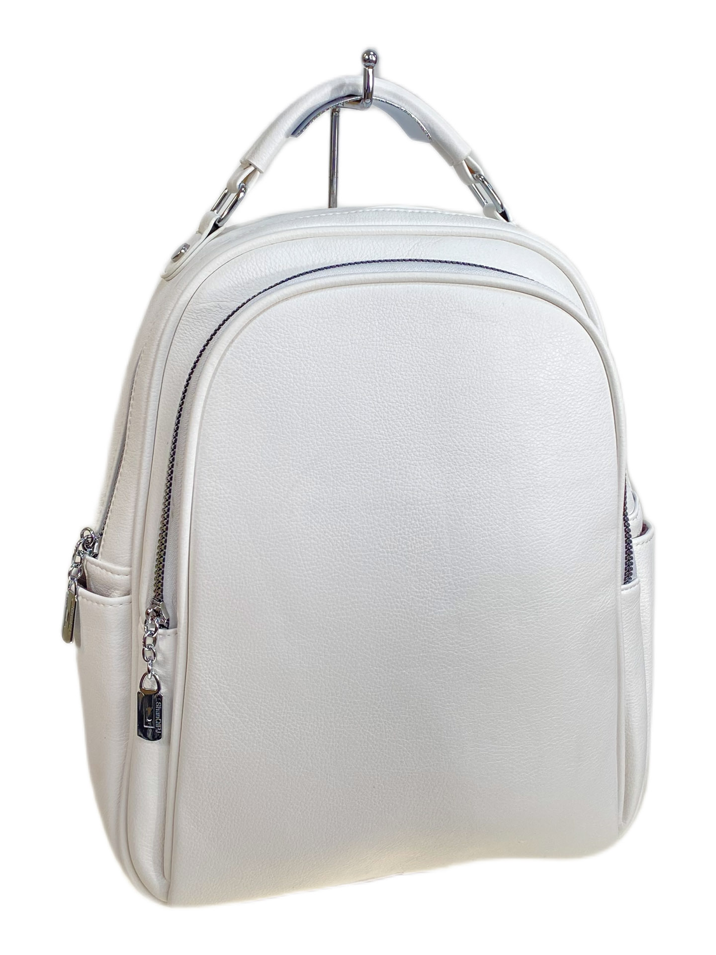 На фото 1 - Женский рюкзак из искусственной кожи, цвет белый